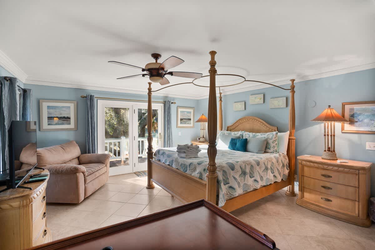 Primary Bedroom with a En-Suite Bathroom, and Balcony. This Bedroom also Includes a Brand-New Smart TV.