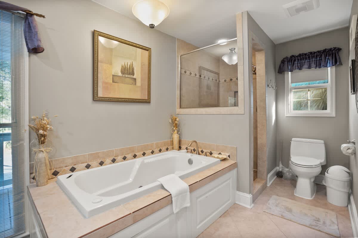 En-Suite Bathroom Complete with a Walk-In Shower, Soaking Tub