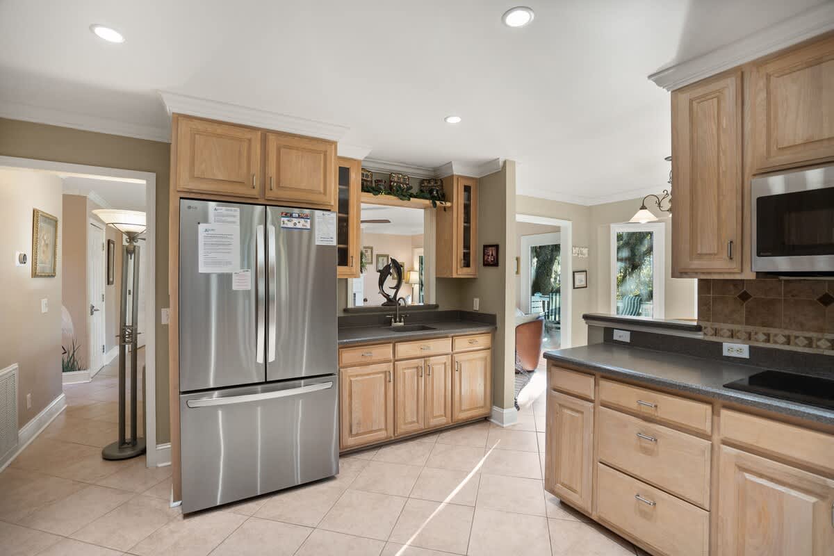  Kitchen Includes Brand-New Stainless Steel Appliances, a Coffee Machine, Kitchen Knives, and Cookware, as well as a Small Dining Table.