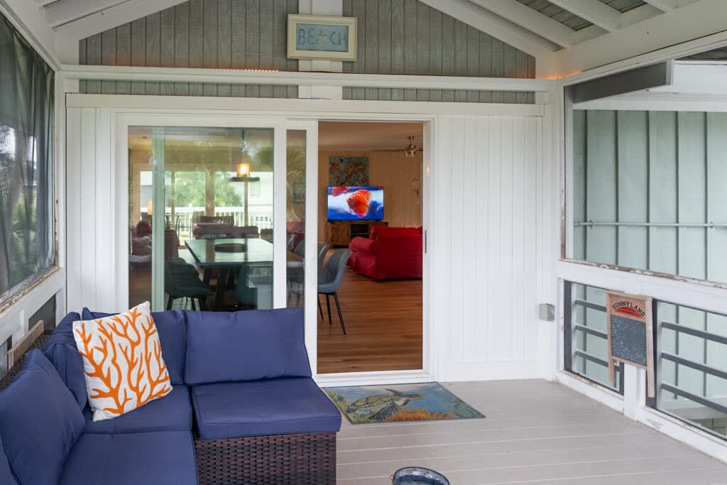 Screened Porch off of Living Room and Dining/Kitchen Area with Access to the Pool