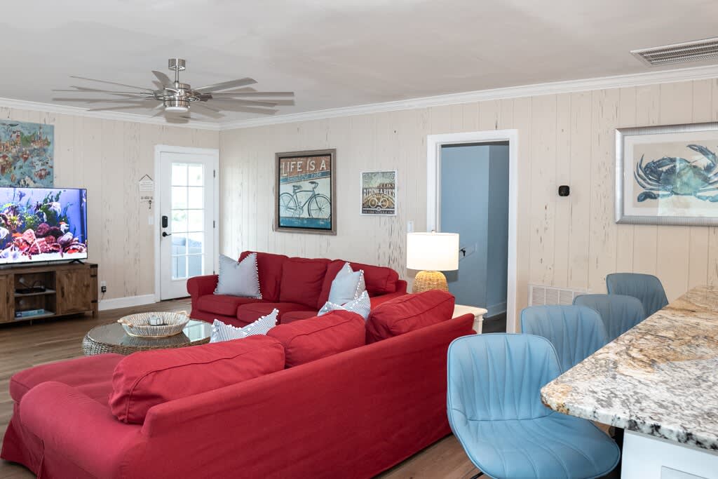 Open Concept Living Room with Access to Front Porch and Screened Porch