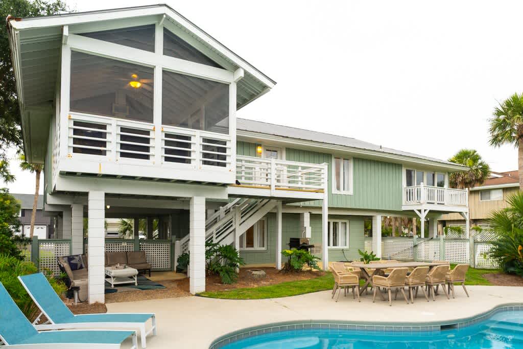 Back of the House with Staircase from Screened Porch and Kitchen to the Pool Area
