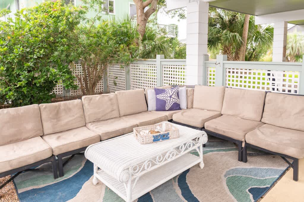 Seating Area Near Pool Under Screened Porch