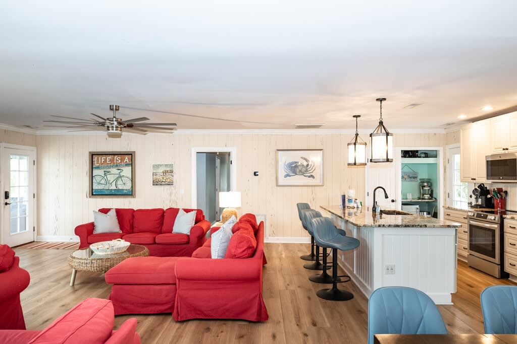 Open Concept Living Room with Access to Front Porch and Screened Porch