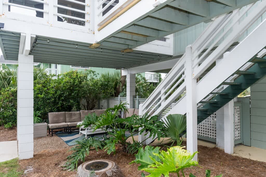 Seating Area Near Pool Under Screened Porch