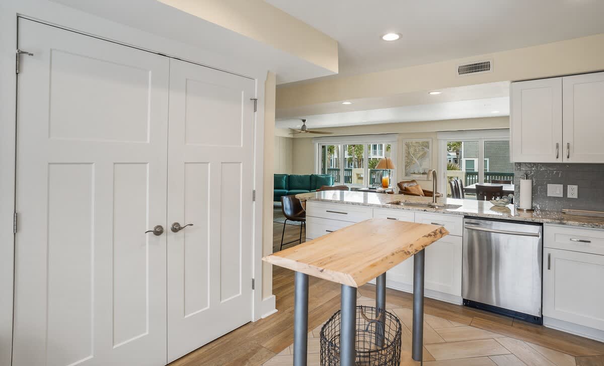 Well equipped kitchen with island and laundry room