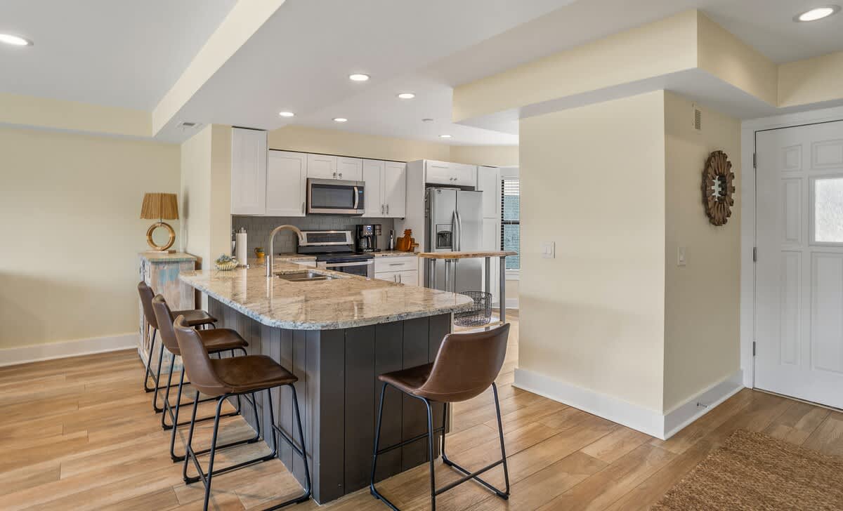 Well equipped kitchen with island and laundry room
