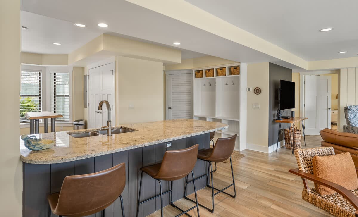 Well equipped kitchen with island and laundry room