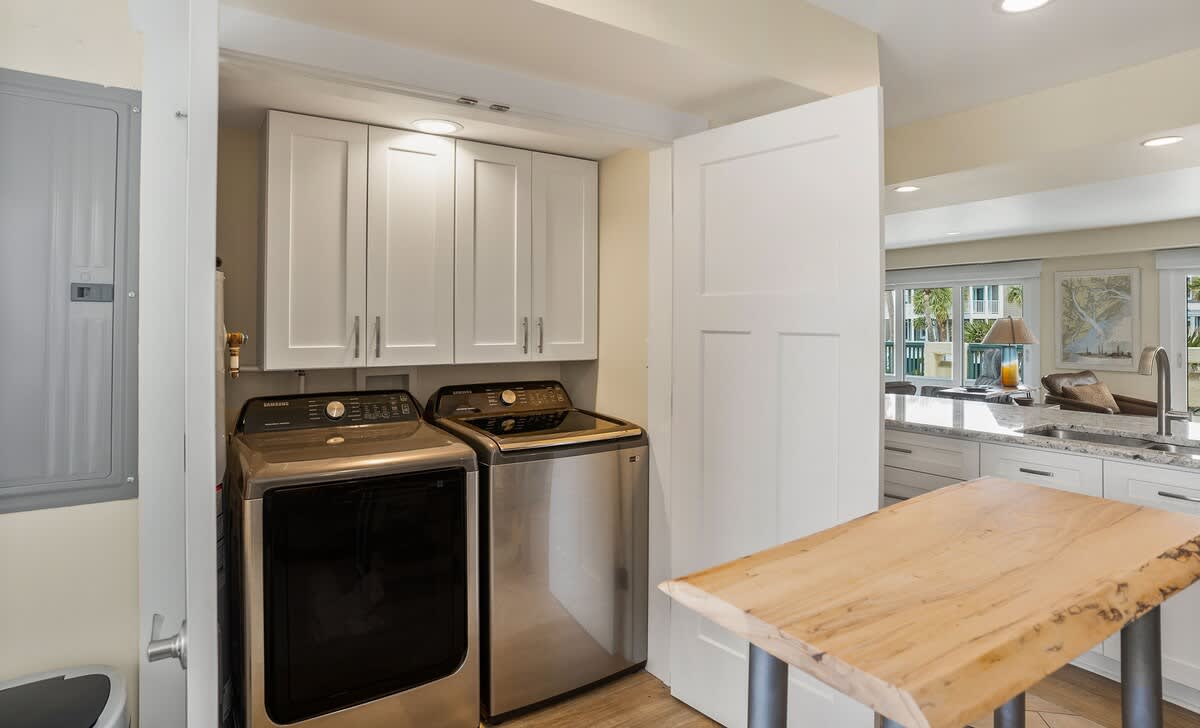 Well equipped kitchen with island and laundry room