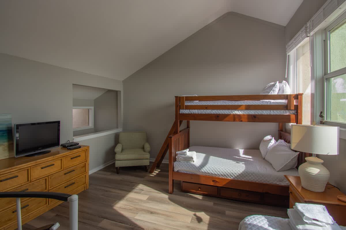 2nd Level Guest Bedroom with 1 Twin Bed, 1 Twin over Double Bunk Bed and Full En Suite Bathroom