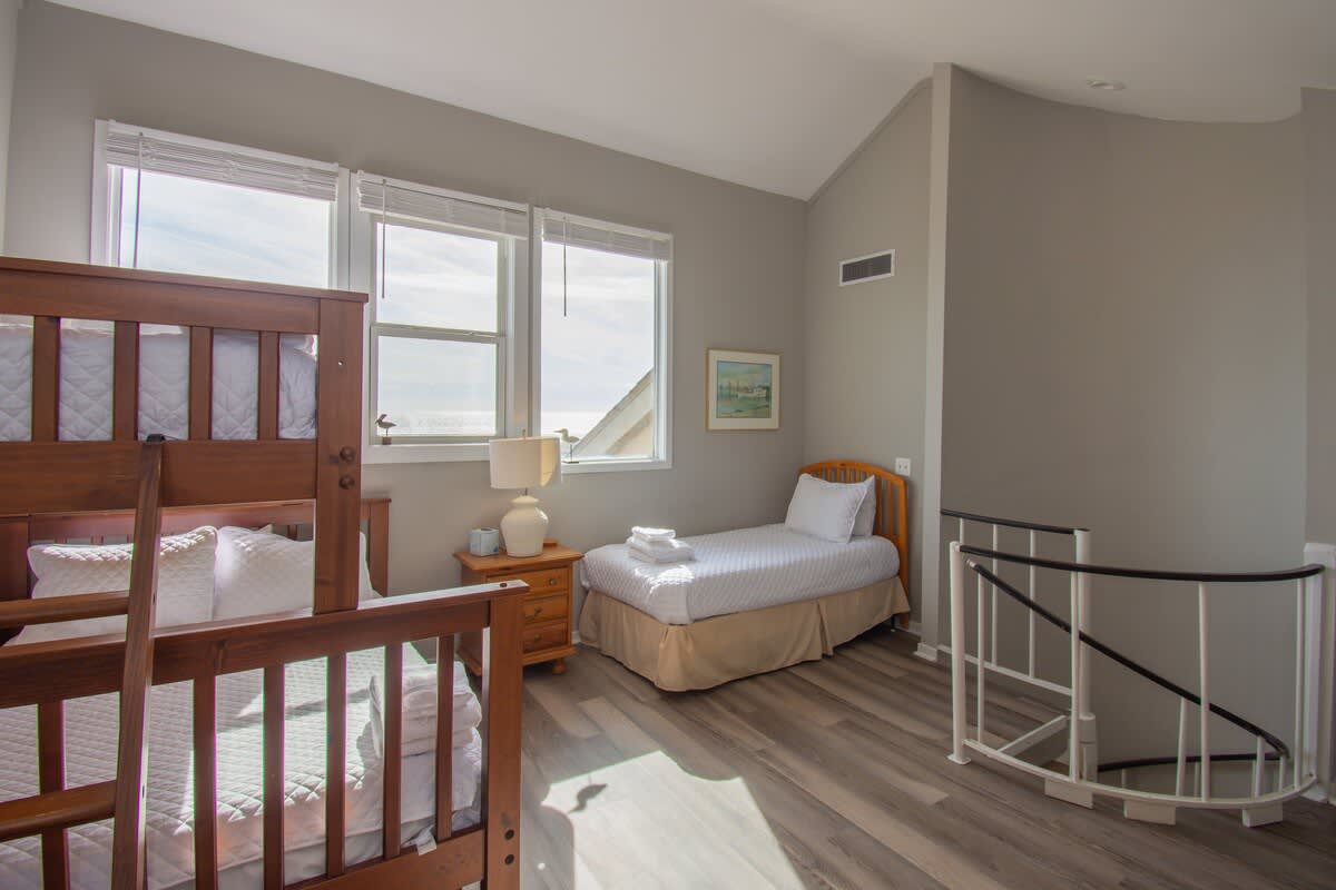 2nd Level Guest Bedroom with 1 Twin Bed, 1 Twin over Double Bunk Bed and Full En Suite Bathroom