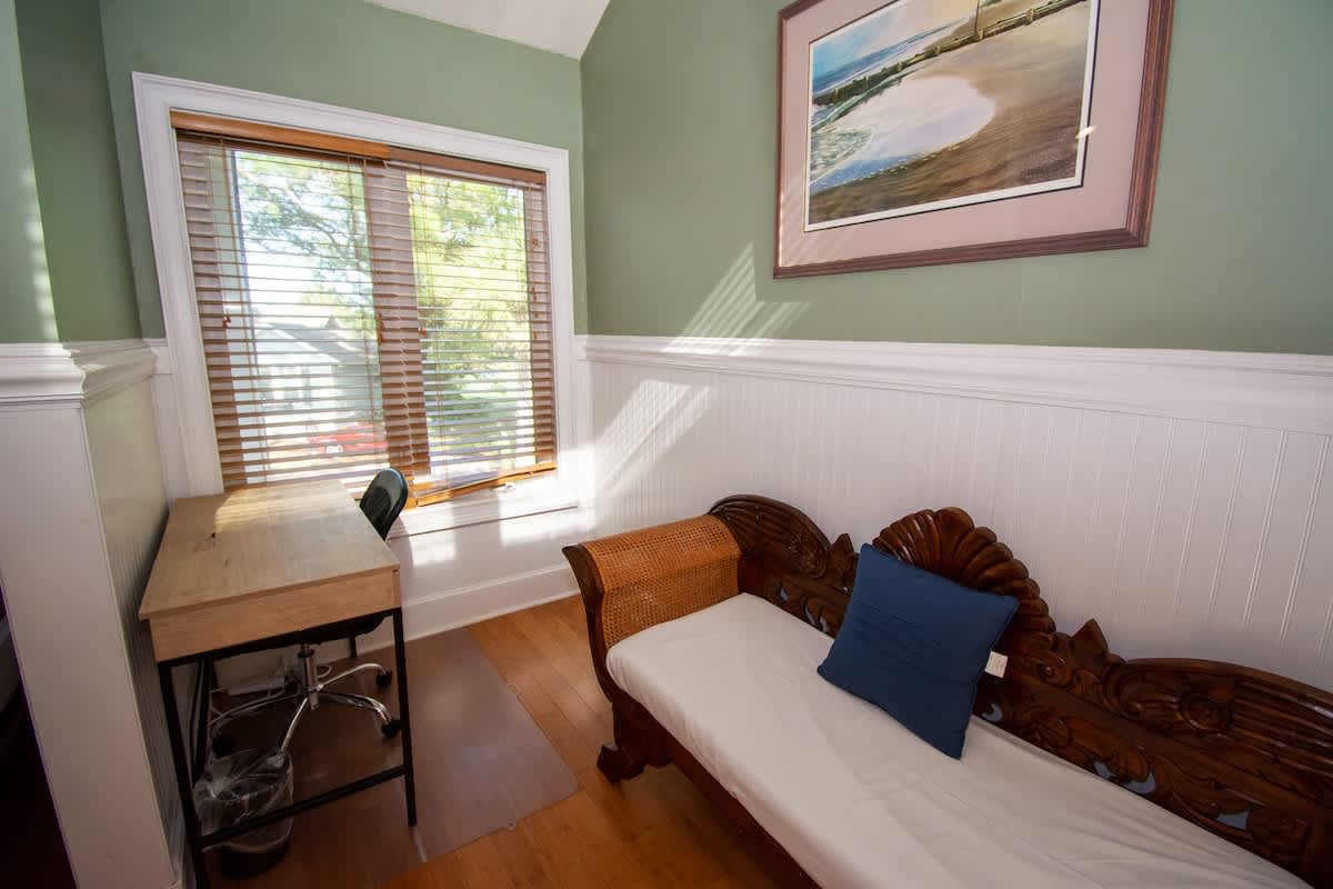 Second floor bedroom area with queen bed, trundle day bed, and en suite full bathroom.