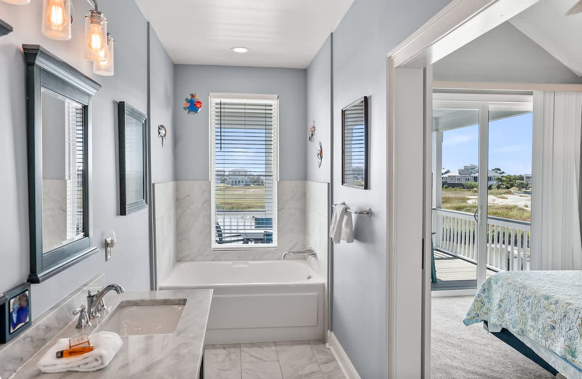 Primary En-Suite with Double Sink Vanity, Walk In Shower, and Tub 
