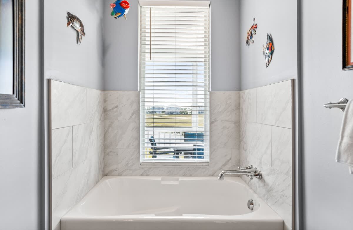 Primary En-Suite with Double Sink Vanity, Walk In Shower, and Tub 