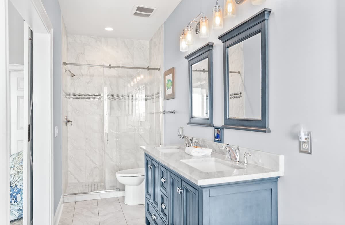 Primary En-Suite with Double Sink Vanity, Walk In Shower, and Tub 