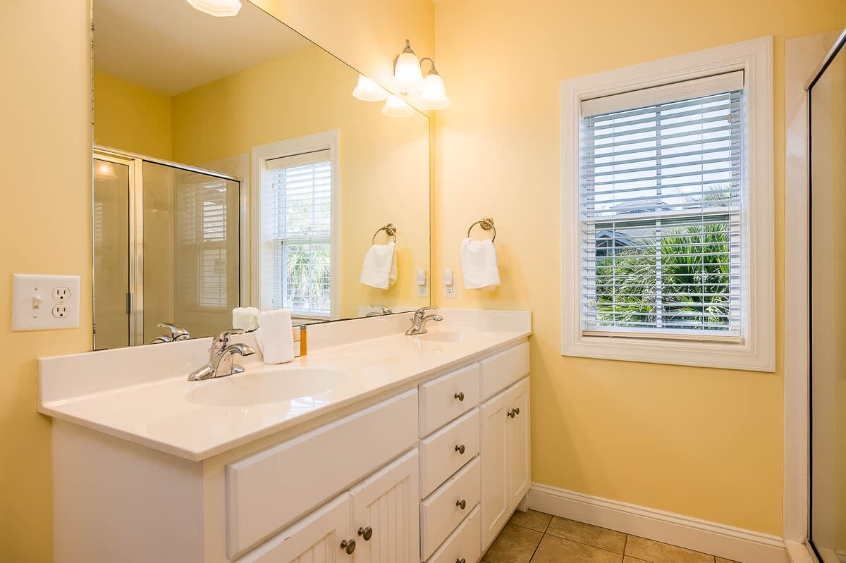 Primary En-Suite with a Walk-In Shower and Double Vanity Sink 