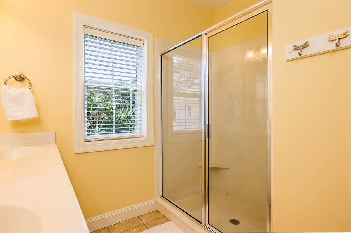 Primary En-Suite with a Walk-In Shower and Double Vanity Sink 