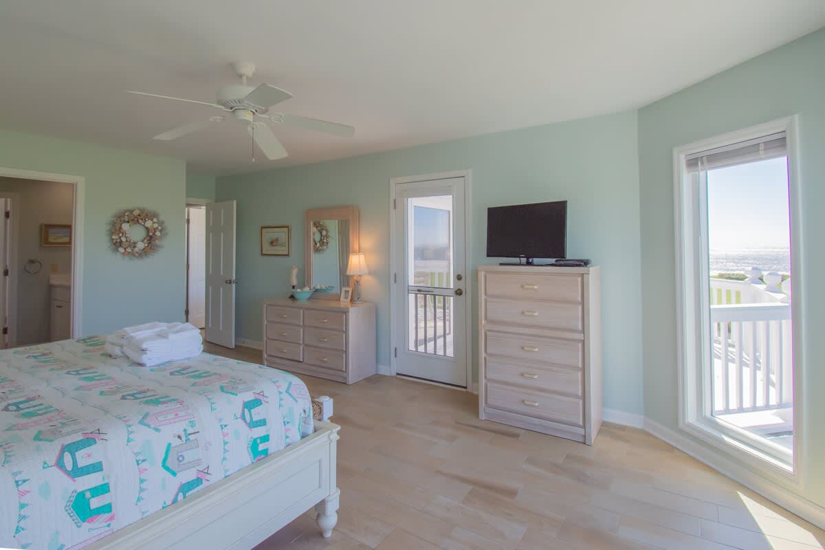 Primary bedroom with en suite bathroom and spectacular balcony views