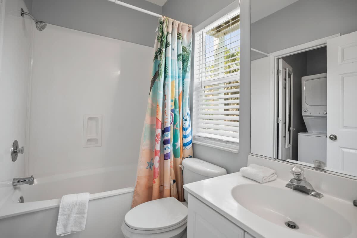Guest Bedroom En-Suite with a Shower Tub Combo 