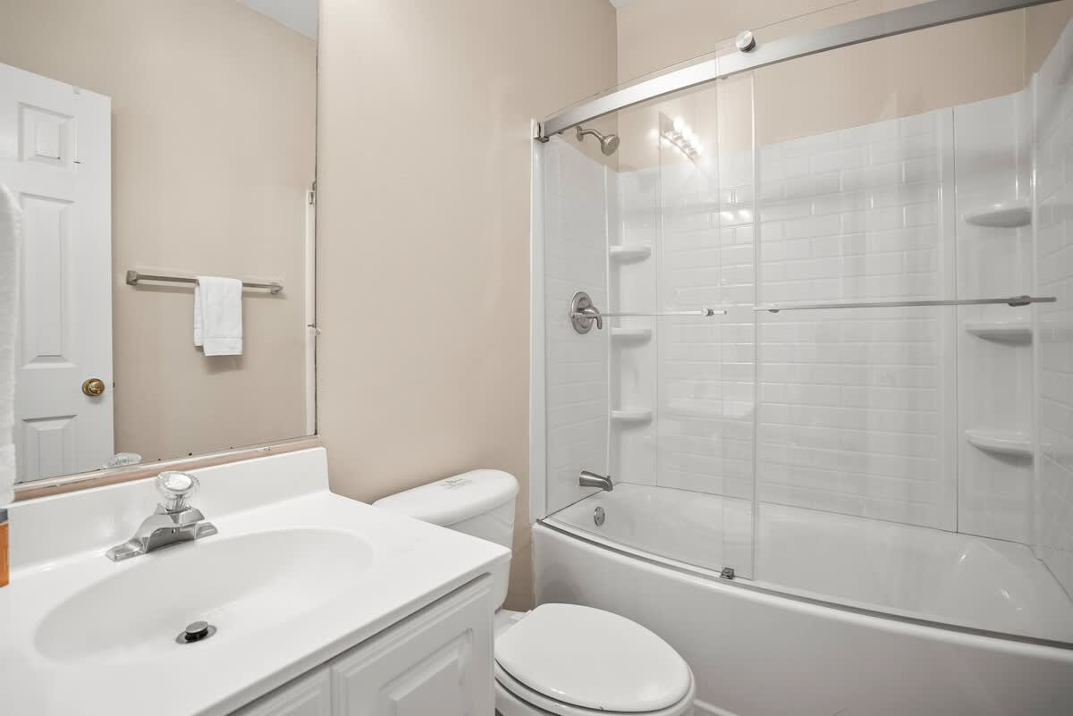 Guest Bedroom En-Suite with a Shower Tub Combo 