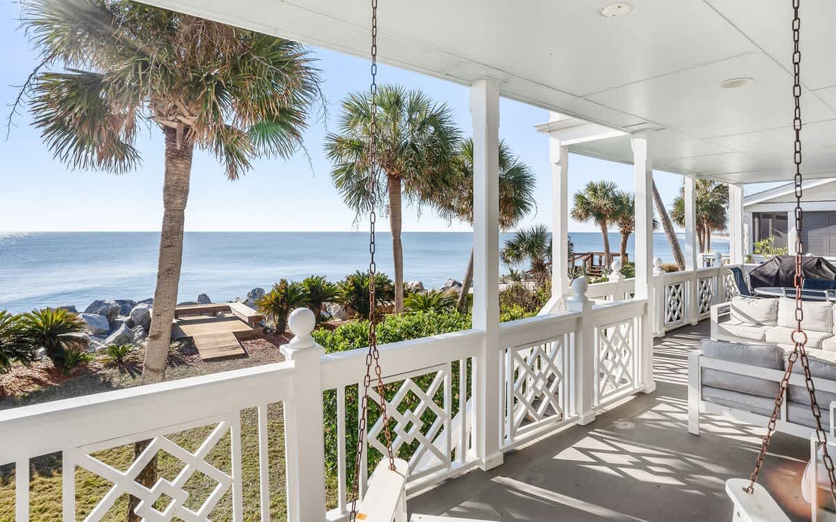 Ocean Front Balcony with Seating, Grill and Access to the Living Room/Kitchen, Primary 1st Level Bedroom