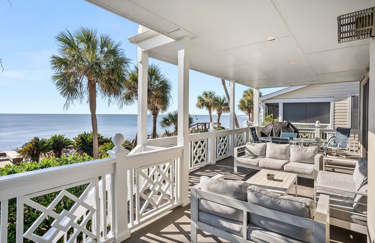 Ocean Front Balcony with Seating, Grill and Access to the Living Room/Kitchen, Primary 1st Level Bedroom