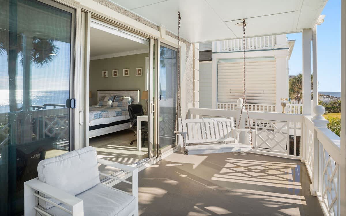 Ocean Front Balcony with Seating, Grill and Access to the Living Room/Kitchen, Primary 1st Level Bedroom