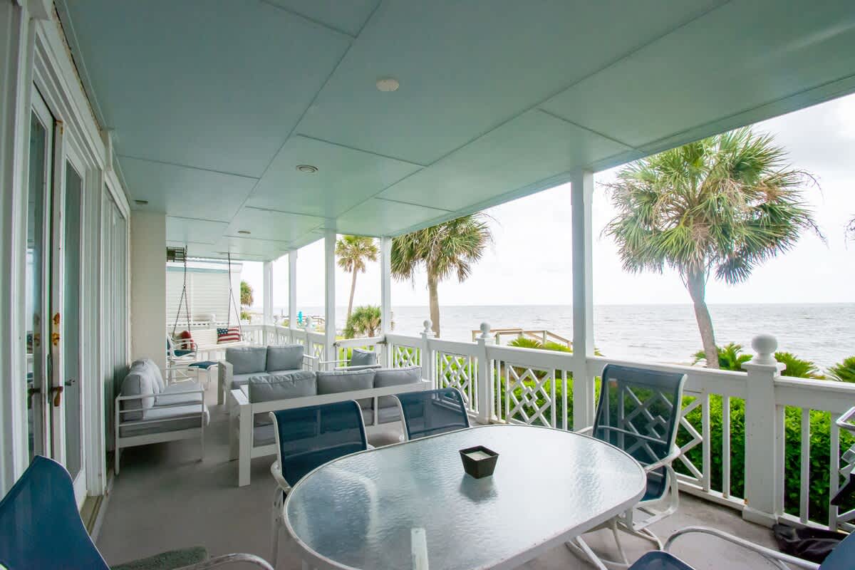 Ocean Front Balcony with Seating, Grill and Access to the Living Room/Kitchen Primary 1st Level Bedroom