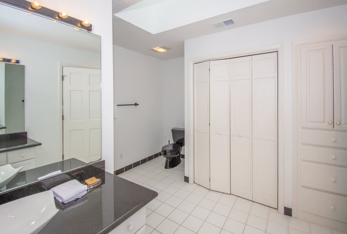 Guest Bedroom En-Suite with Two Sinks, and Walk-In Shower 