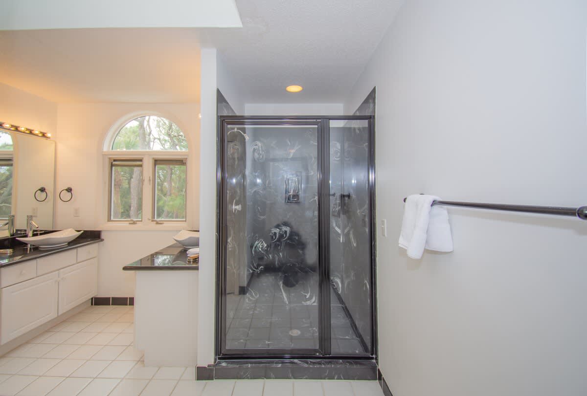 Guest Bedroom En-Suite with Two Sinks, and Walk-In Shower 