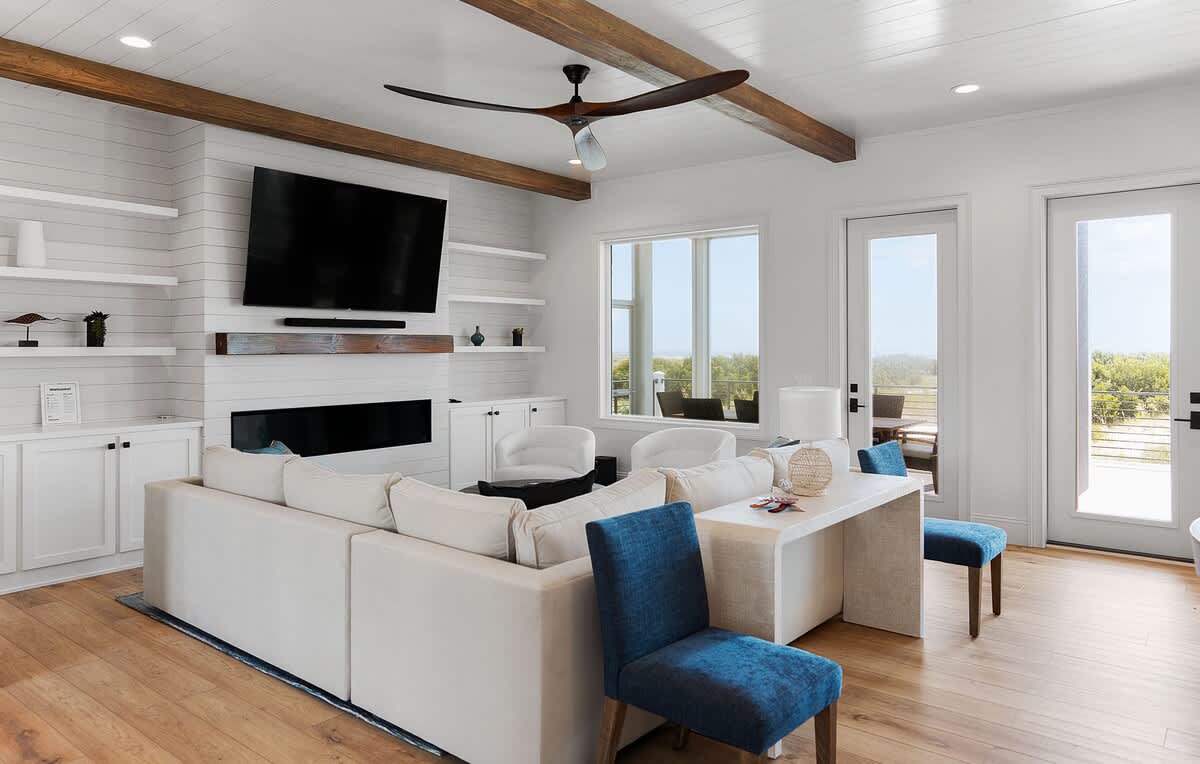 Living Room with Sectional and Access to Screened in Porch 