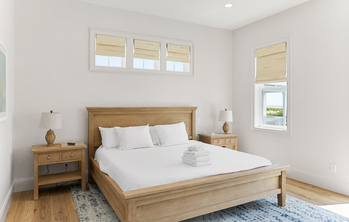 Primary Bedroom on first floor with Access to Back Deck and En-Suite 