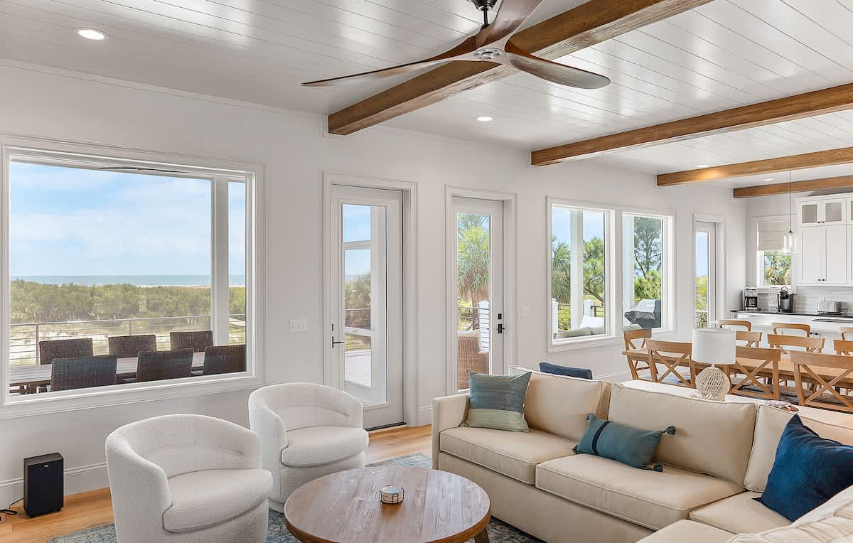 Living Room with Sectional and Access to Screened in Porch 