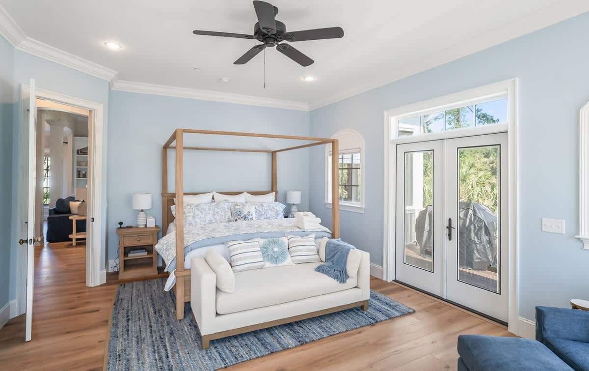 Primary Bedroom on First Floor with King Bed, Access out to Balcony and En-Suite