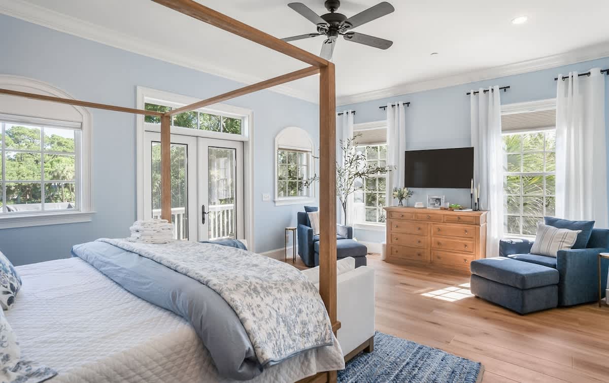 Primary Bedroom on First Floor with King Bed, Access out to Balcony and En-Suite