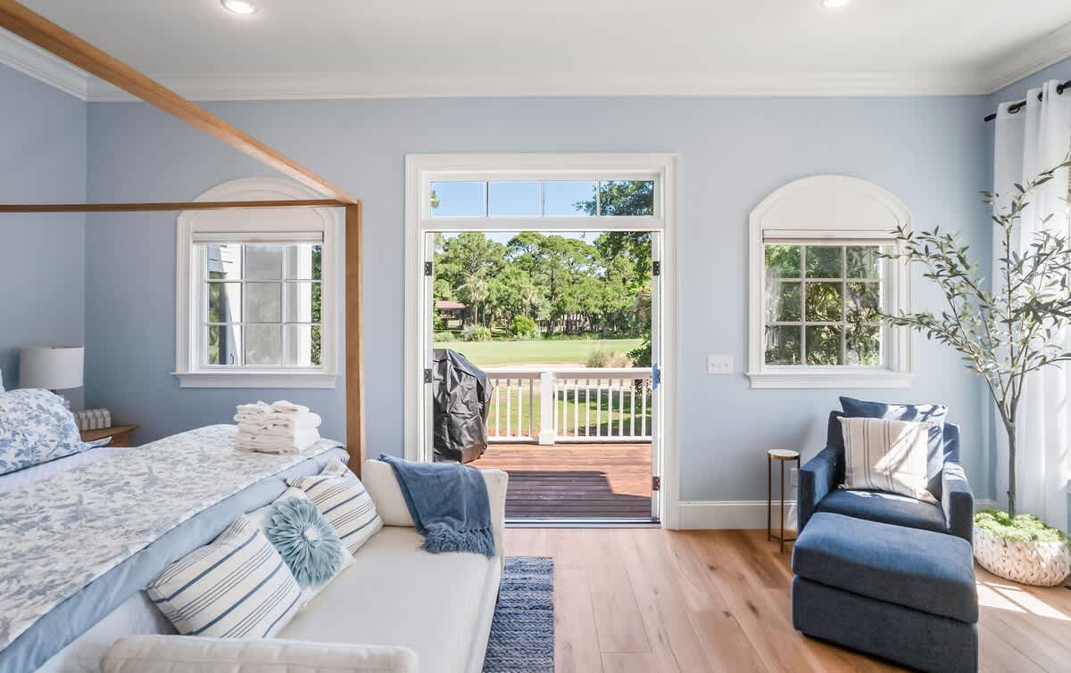 Primary Bedroom on First Floor with King Bed, Access out to Balcony and En-Suite