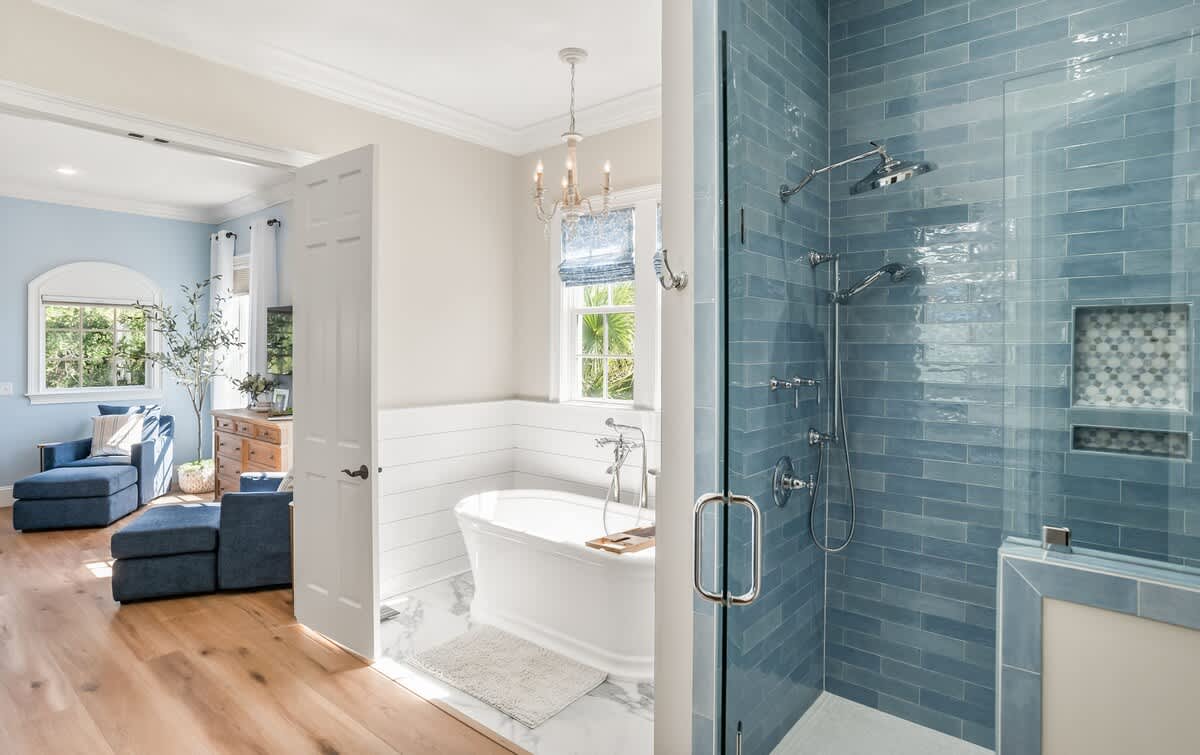 The Primary Bathroom Includes a Freestanding Tub, Double Vanity Sinks, and a Walk-In Shower