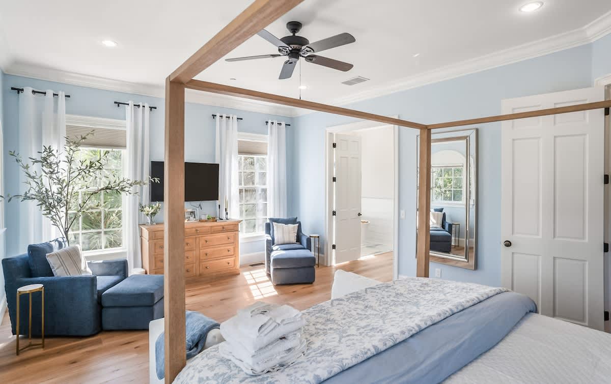 Primary Bedroom on First Floor with King Bed, Access out to Balcony and En-Suite