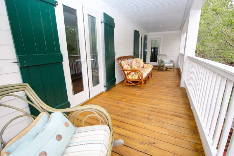 Porch off Primary Bedroom. Overlooks Backyard. 