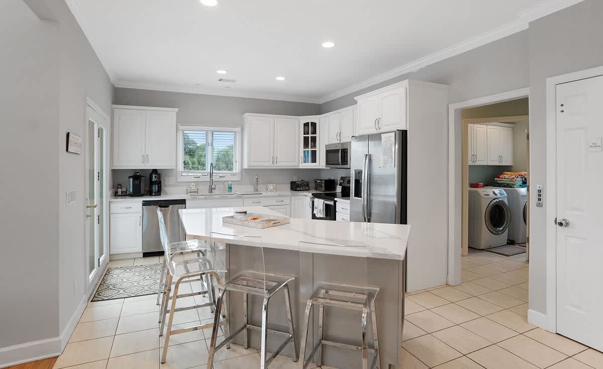 Open concept second floor living room, dining room and kitchen