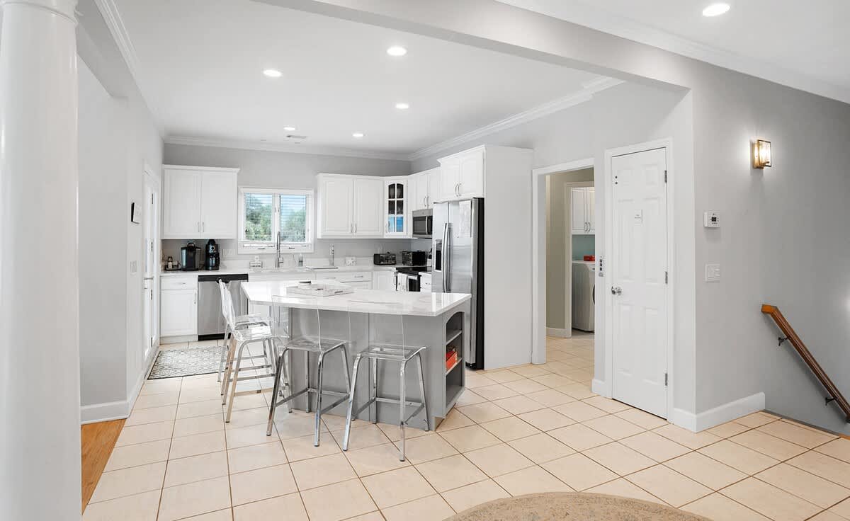 Open concept second floor living room, dining room and kitchen