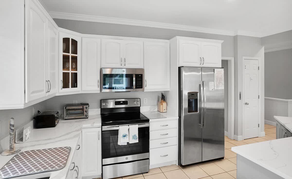 Open concept second floor living room, dining room and kitchen