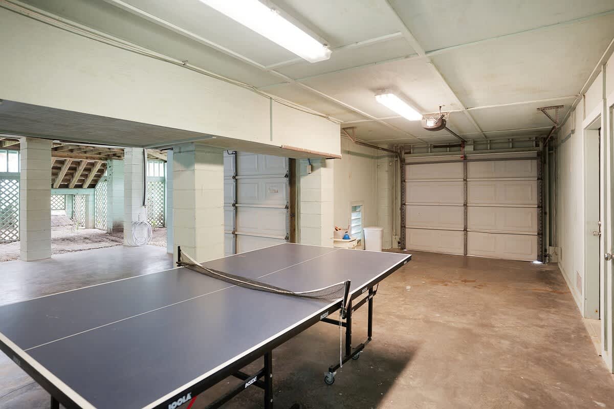 Huge garage with ping pong table and bikes
