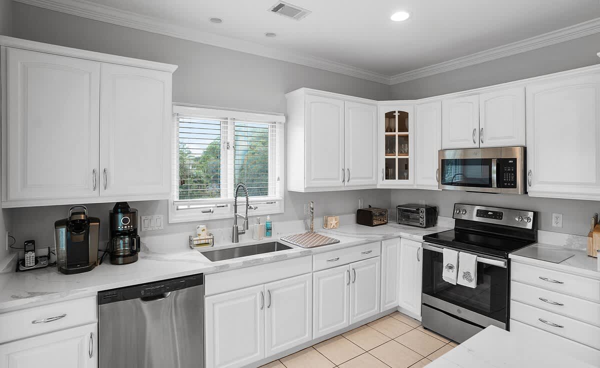 Open concept second floor living room, dining room and kitchen