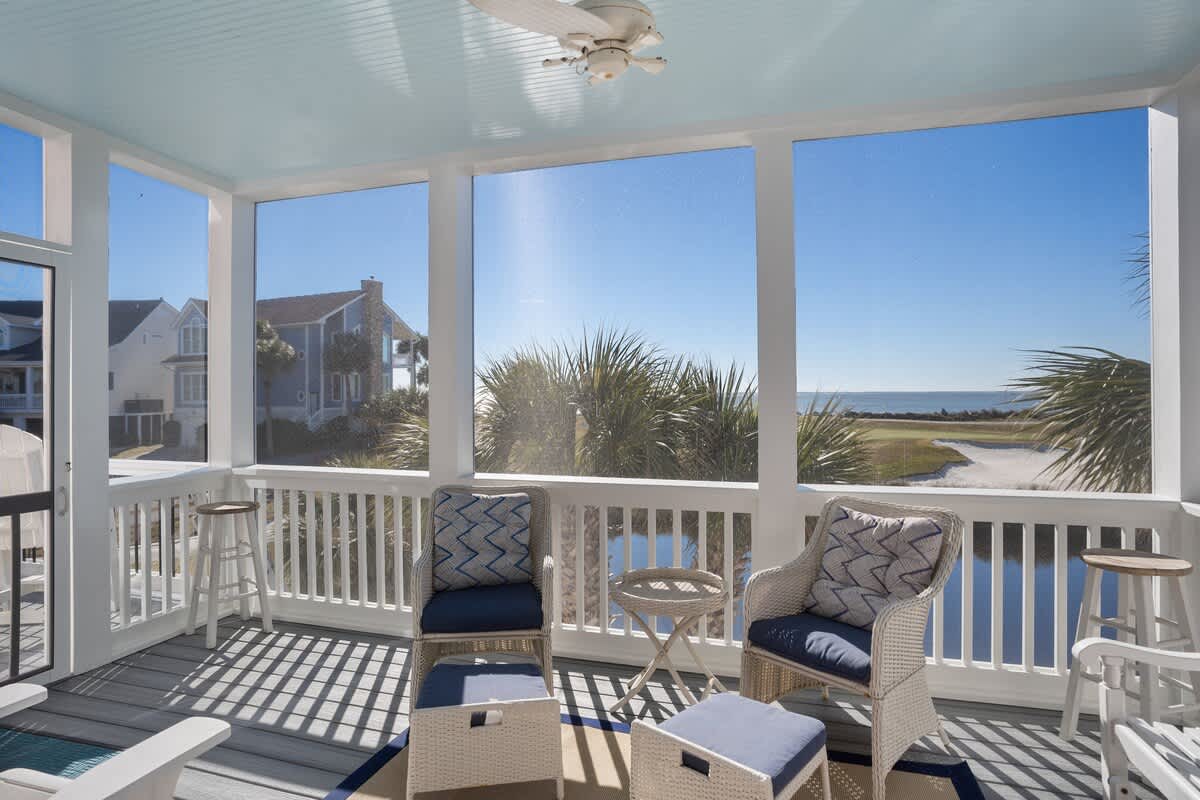 Screened in porch with stunning beach and golf course views