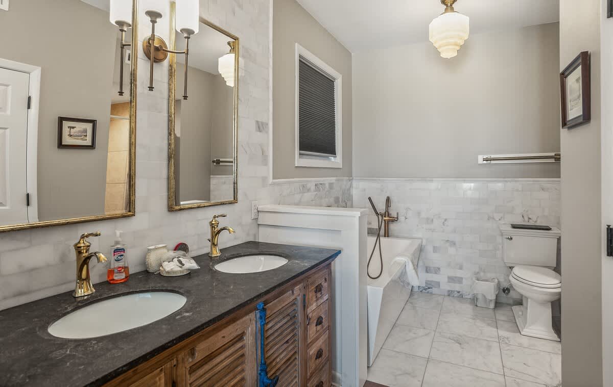 First floor primary bedroom and en suite full bathroom