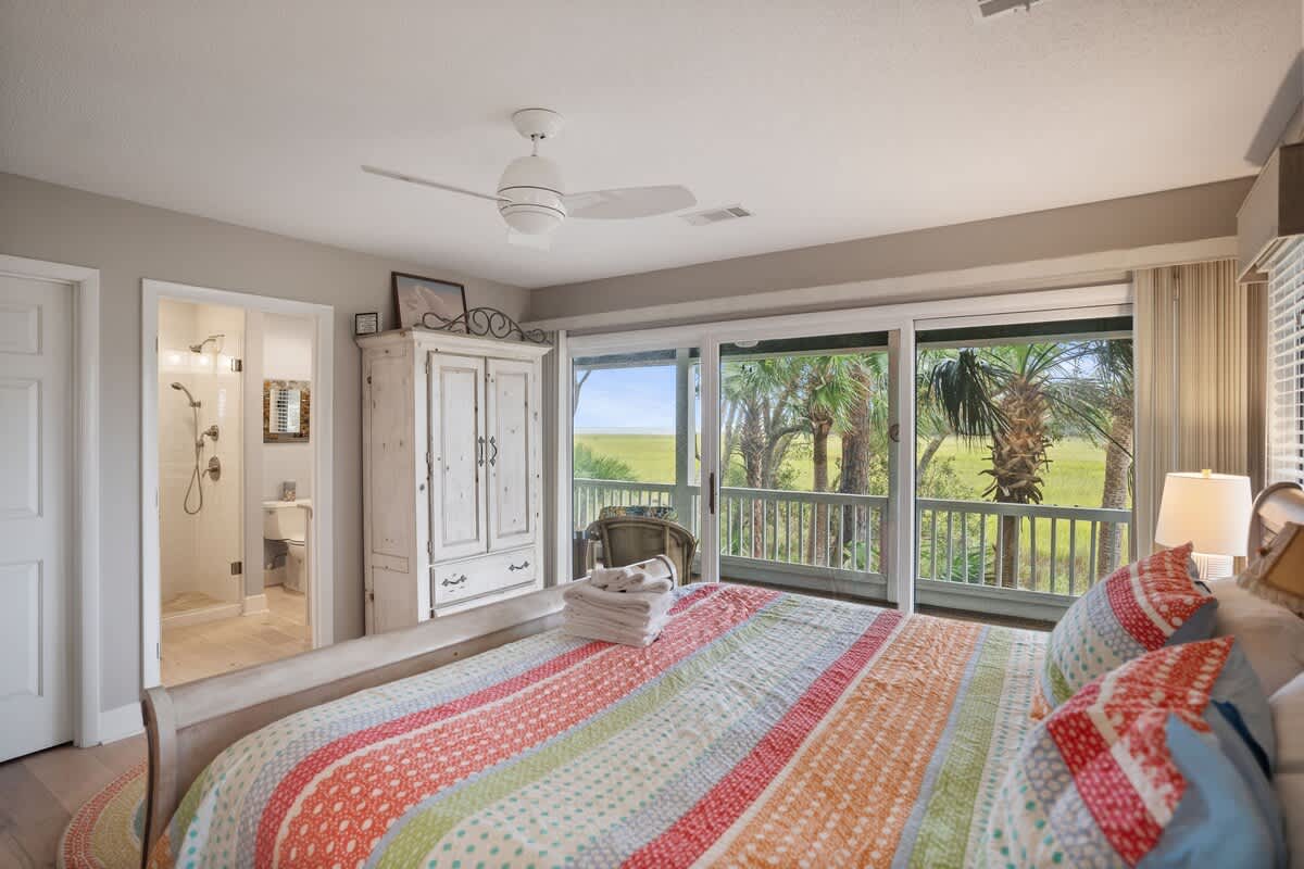 Primary Bedroom with King Bed and Access to Marsh View Screened Porch