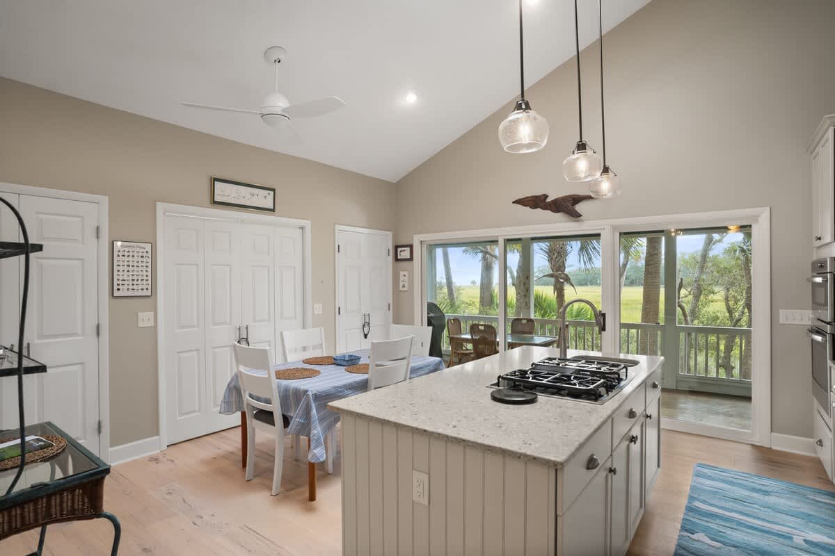 Dining Area with Kitchen Island and Access to Screened Porch
