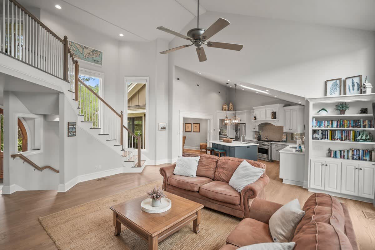 Open Concept Living Room with Access to Decks and Screened Porch with Marsh and Ocean Views