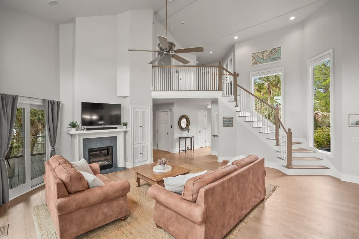 Open Concept Living Room with Access to Decks and Screened Porch with Marsh and Ocean Views